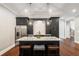 Bright kitchen with stainless steel appliances, marble countertops, and a spacious island with seating at 2377 Kesgrove Way, Buford, GA 30518