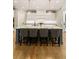 Kitchen with island seating and pendant lights, in neutral tones at 2377 Kesgrove Way, Buford, GA 30518