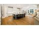 Bright kitchen with a center island, hardwood floors, and a cozy seating area with vaulted ceilings at 2377 Kesgrove Way, Buford, GA 30518