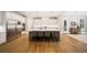 Spacious kitchen features a large island with seating, modern appliances, and hardwood floors at 2377 Kesgrove Way, Buford, GA 30518