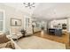 Open concept living room with hardwood floors and view to kitchen at 2377 Kesgrove Way, Buford, GA 30518