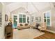 Bright living room with hardwood floors, shutters, and ample natural light at 2377 Kesgrove Way, Buford, GA 30518