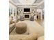Stylish living room with fireplace, built-in bookshelves, and plush seating at 2377 Kesgrove Way, Buford, GA 30518