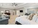 Expansive main bedroom with a comfy sitting area, dresser, and a dedicated office space at 2377 Kesgrove Way, Buford, GA 30518