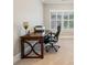 Office space near a window, providing ample natural light, with desk and office chair at 2377 Kesgrove Way, Buford, GA 30518
