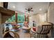 Relaxing screened porch with comfortable seating, a cozy fireplace, and a view of the outdoor pool at 2377 Kesgrove Way, Buford, GA 30518