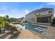 Gorgeous pool and patio is perfect for relaxation and entertaining, enhancing this home's outdoor appeal at 2377 Kesgrove Way, Buford, GA 30518