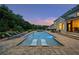Beautiful backyard with a pool, lounge chairs, and lush greenery, ideal for relaxation at 2377 Kesgrove Way, Buford, GA 30518
