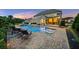 Resort-style backyard with a stunning pool, lush landscaping, and plenty of lounge space at 2377 Kesgrove Way, Buford, GA 30518