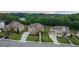 Beautifully landscaped homes on a manicured street, showcasing curb appeal and neighborhood charm at 2377 Kesgrove Way, Buford, GA 30518