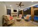 Cozy screened-in porch with a fireplace and comfortable seating, perfect for enjoying the outdoors year-round at 2377 Kesgrove Way, Buford, GA 30518