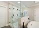 This glass enclosed walk-in shower has multiple shower heads and an open design at 2377 Kesgrove Way, Buford, GA 30518