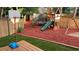Backyard features a trampoline, playground, and bordered by a wooden fence at 340 Fountainmist Trl, Lawrenceville, GA 30043