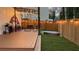 Backyard with a deck, seating, grill, hot tub, and a wooden fence at 340 Fountainmist Trl, Lawrenceville, GA 30043