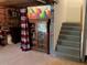 Partially finished basement with furniture and stairs to the upper level at 340 Fountainmist Trl, Lawrenceville, GA 30043