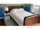 This bedroom is decorated with black and white checkered wallpaper and blue walls at 340 Fountainmist Trl, Lawrenceville, GA 30043