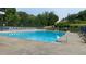 Community pool with many chairs and umbrellas for residents' comfort at 340 Fountainmist Trl, Lawrenceville, GA 30043