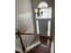 Elegant entryway with hardwood floors, a chandelier, and a staircase with white railings at 340 Fountainmist Trl, Lawrenceville, GA 30043
