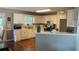 Well-lit kitchen with white cabinets, stainless steel appliances, and a breakfast bar area at 340 Fountainmist Trl, Lawrenceville, GA 30043