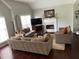 Spacious living room with fireplace, hardwood floors, and large windows offering natural light at 340 Fountainmist Trl, Lawrenceville, GA 30043