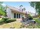 Spacious backyard features a patio, dining set, grill, and well-maintained lawn at 5365 Twin Creeks Dr, Norcross, GA 30071