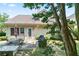 Backyard with a patio, outdoor seating, grill, and mature trees for shade at 5365 Twin Creeks Dr, Norcross, GA 30071