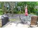 Cozy patio area with outdoor seating and a grill, ideal for outdoor entertaining at 5365 Twin Creeks Dr, Norcross, GA 30071