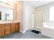 Bathroom with walk-in shower and bathtub at 5365 Twin Creeks Dr, Norcross, GA 30071
