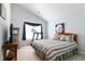 Bedroom featuring a cozy bed, natural light, and space for exercise equipment at 5365 Twin Creeks Dr, Norcross, GA 30071