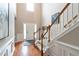 Inviting foyer with hardwood floors, staircase, and high ceilings at 5365 Twin Creeks Dr, Norcross, GA 30071