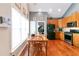 Bright kitchen with wooden cabinetry, stainless steel appliances, and a beautiful wood floor at 5365 Twin Creeks Dr, Norcross, GA 30071