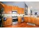 Updated kitchen boasts stainless steel appliances, granite countertops, and ample storage at 5365 Twin Creeks Dr, Norcross, GA 30071