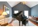 Elegant room with vaulted ceilings, a grand piano, and a chandelier at 5365 Twin Creeks Dr, Norcross, GA 30071