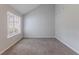 Cozy bedroom with neutral carpet, vaulted ceilings, and a large window offering natural light at 5421 Salem Springs Dr, Lithonia, GA 30038