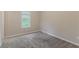 Bedroom with carpet and neutral walls with a window creating a bright atmosphere at 5421 Salem Springs Dr, Lithonia, GA 30038