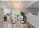 Bright dining room with a glass table, chandelier, and natural light, perfect for Gathering meals and entertaining at 5421 Salem Springs Dr, Lithonia, GA 30038