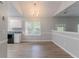 Bright dining area with a window and sleek wood floors, offering a cozy space for meals at 5421 Salem Springs Dr, Lithonia, GA 30038