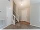 Inviting entryway with carpet flooring, a staircase, and a view of the front door at 5421 Salem Springs Dr, Lithonia, GA 30038