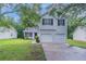 Charming two-story home with a well-maintained lawn and a two-car garage, offering curb appeal and convenience at 5421 Salem Springs Dr, Lithonia, GA 30038