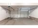 A spacious two car garage with two seperate doors and concrete floor at 5421 Salem Springs Dr, Lithonia, GA 30038