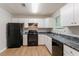 Efficient kitchen with a gas range, and ample storage, perfect for cooking and entertaining at 5421 Salem Springs Dr, Lithonia, GA 30038