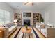 Cozy living room with a fireplace, plush sofas, and stylish decor, creating a relaxing atmosphere at 5421 Salem Springs Dr, Lithonia, GA 30038