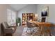 Inviting home office with a wooden desk, comfortable seating, and ample natural light, ideal for productivity at 5421 Salem Springs Dr, Lithonia, GA 30038