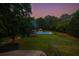 Large backyard featuring an in-ground pool with a colorful cabana at 1851 Harvest Way, Loganville, GA 30052