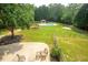 Aerial view of backyard with pool, outdoor seating, and grassy area at 1851 Harvest Way, Loganville, GA 30052