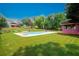 Spacious backyard features a large in-ground pool and plenty of grassy area at 1851 Harvest Way, Loganville, GA 30052