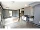 Finished basement area with gray walls, neutral flooring, and bar with tiled countertop at 1851 Harvest Way, Loganville, GA 30052
