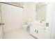 Bright bathroom featuring a shower-tub combo and a single sink vanity with white cabinets at 1851 Harvest Way, Loganville, GA 30052