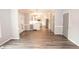 Open-concept living area with hardwood floors and neutral paint, providing an inviting space for relaxation and entertainment at 1851 Harvest Way, Loganville, GA 30052