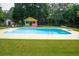 Features include a large in-ground pool and a colorful cabana at 1851 Harvest Way, Loganville, GA 30052